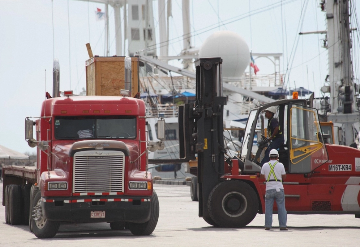 Driver checking the manifest on the dock